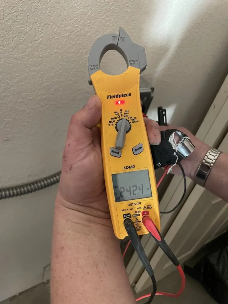 Voltage testing with clamp meter during Ceiling Fan Installation in Vail